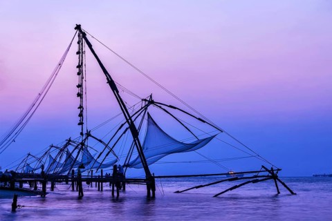 Kochi chinese fishnets on sunset in Fort Kochin