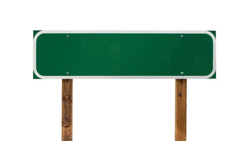 Blank green road sign with wooden posts isolated on a white background