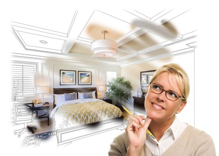 Daydreaming creative woman with pencil over custom bedroom design drawing and photo combination