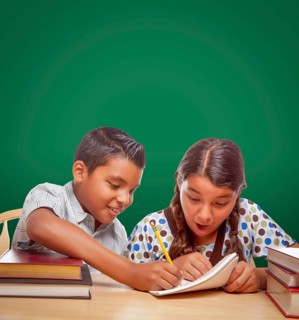 Blank chalk board behind hispanic boy and girl having fun studying together