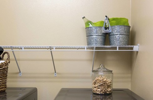 Abstract of laundry room with buckets and jar of clothespins