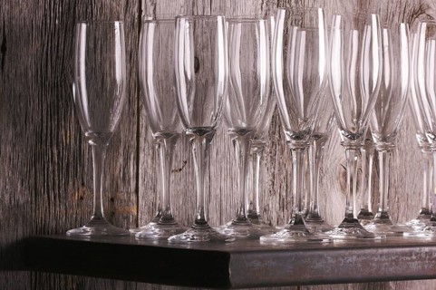 Champagne flutes on shelf abstract
