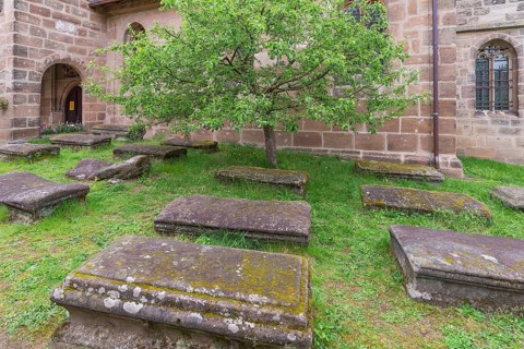 Old graves in the churchyard of the fortified church of St. George