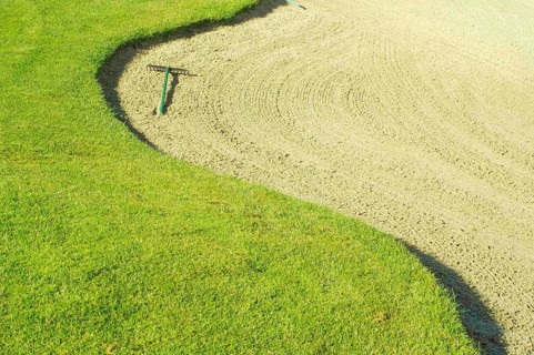 Abstract of golf course and sand bunker