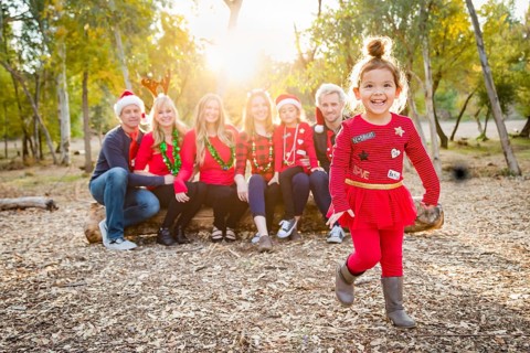Christmas themed multiethnic family portrait outdoors