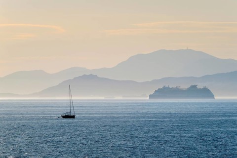 Cruise liner ship and yacht silhouette in Mediterranea sea