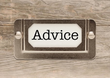Advice metal file label frame on wood background