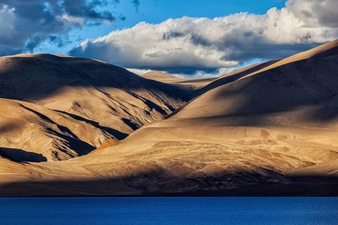 Himalayas and Himalayan mountain lake Tso Moriri on sunset. Korzok