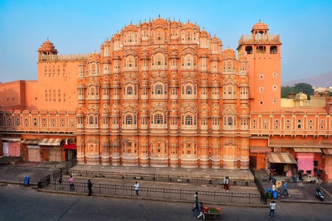 Famous landmak pink Hawa Mahal Palace of winds with people