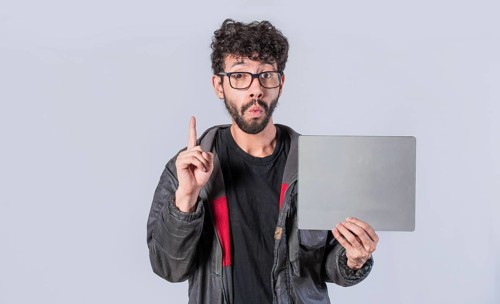 Young man holding poster