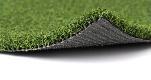 Flipped up section of artificial turf grass on white background