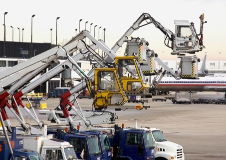 Deicing equipment ready at an airport during A blustery winter day