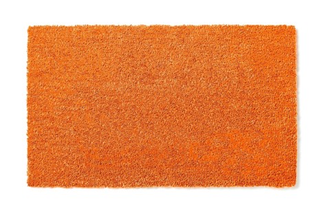 Blank orange welcome mat isolated on white background ready for your own text