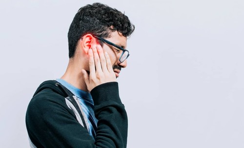 Concept of person with otitis and tinnitus