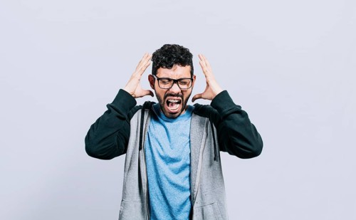 Irritated person screaming with open arms