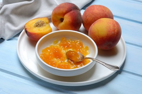 Peach jam in shell and peach tree