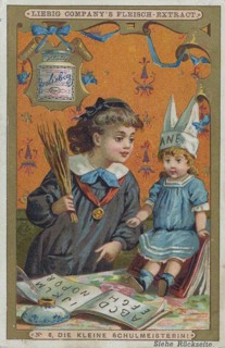 Picture series Girl playing with a doll: the little schoolmistress