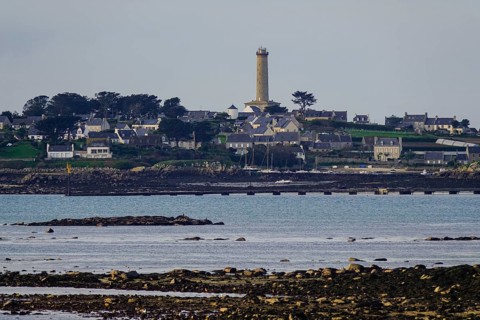 View at low tide from Roscoff to the island Ile de Batz with lighthouse