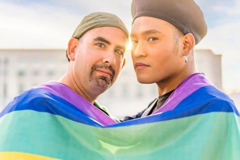 Couple of gay men in love embracing each other
