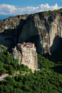 Monastery of Rousanou in famous greek tourist destination Meteora in Greece on sunset with scenic landscape