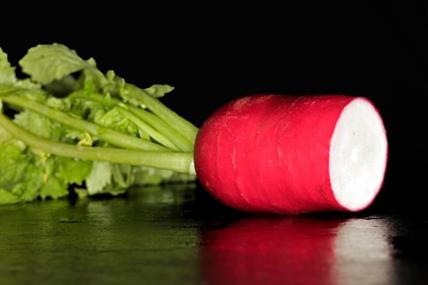 Cut fresh red radish with leaves