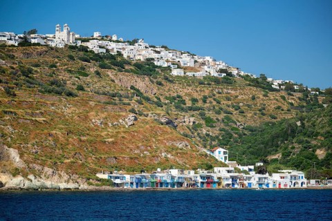 Klima and Plaka villages with whitewhashed traditional houses and orthodox church and windmills on Milos island