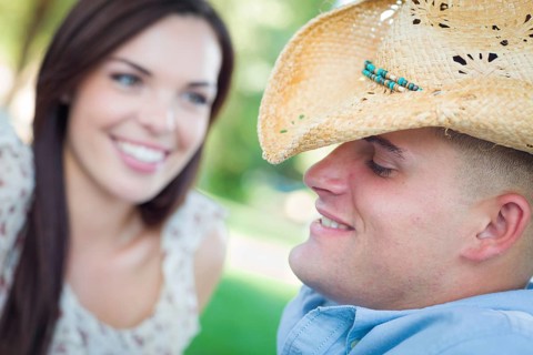 Happy romantic caucasian couple talking in the park