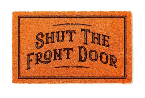 Shut the front door halloween orange welcome mat isolated on white background