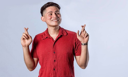 Happy man making a wish