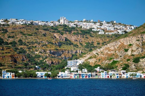 Klima and Plaka villages with whitewhashed traditional houses and orthodox church and windmills on Milos island