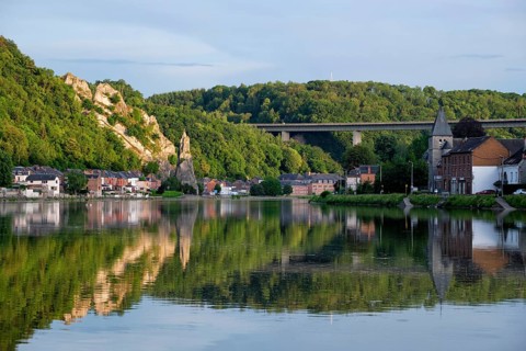 View of picturesque Dinant city over the Meuse river Dinant is a Walloon city and municipality located on the River Meuse
