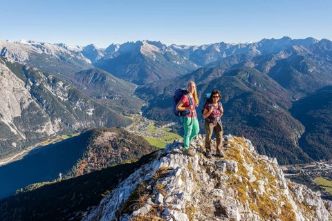 Two female hikers on a summit