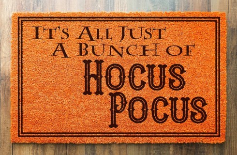 It's all A bunch of hocus pocus halloween orange welcome mat on wood floor background