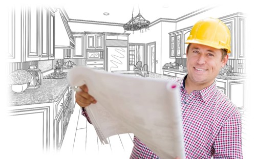 Smiling contractor holding blueprints over custom kitchen drawing