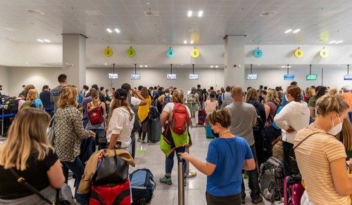 Tourists waiting at the counter in the airport
