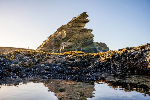 Beautiful landscape and seascape with rock formation in Samoqueira Beach