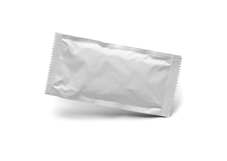 Blank white condiment packet floating isolated on white background
