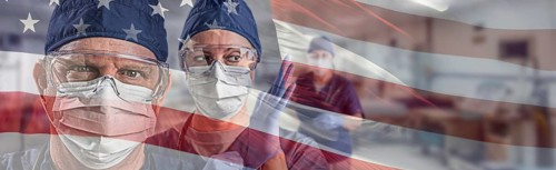 Doctors or nurses wearing medical personal protective equipment