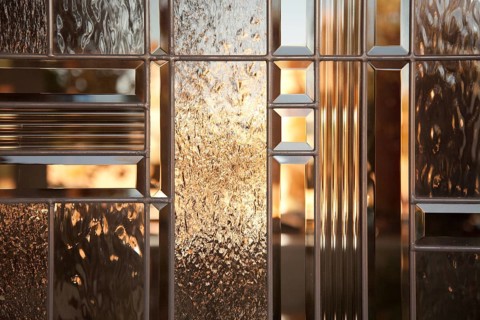 Beautiful beveled glass window with warm reflections