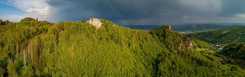 Passing thunderstorm with rainbow