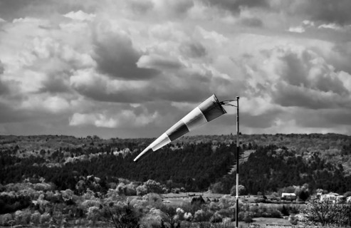 Windsock and cloudy sky