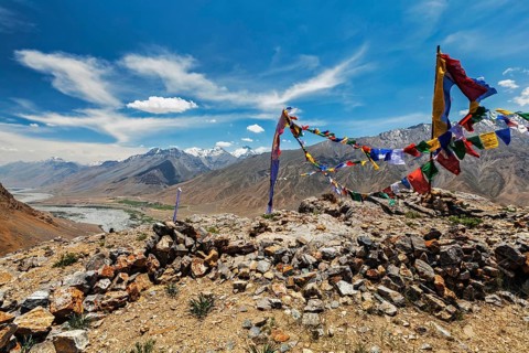 Buddhist prayer flags lungta with Om mani padme hum mantra written on them in Spiti Valley in Himalayas