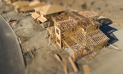 Aerial view of new homes construction site with tilt-shift blur