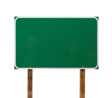 Blank green road sign with wooden posts isolated on a white background
