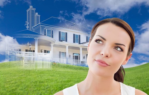 Curious mixed-race female looks over to ghosted house drawing