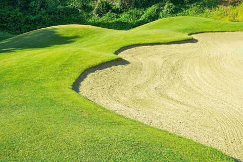 Abstract of golf course and sand bunker