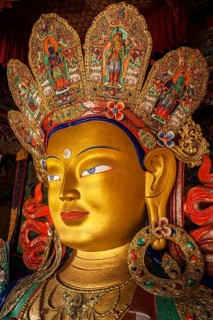 Maitreya Buddha statue face close up in Thiksey Gompa. Ladakh