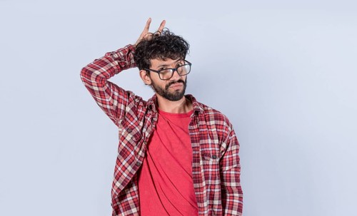 Man with fingers cuckolding