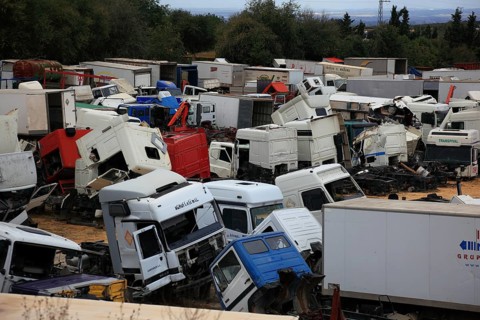 Car cemetery with truck