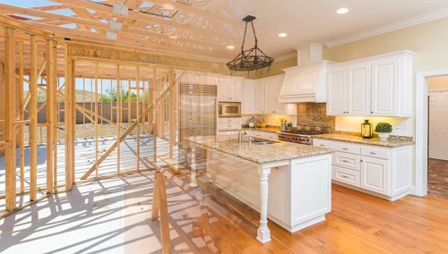House construction framing gradating into finished kitchen build